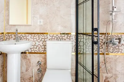 a bathroom with a toilet and a sink at The Wall Private Mansion Kumkapı in Istanbul