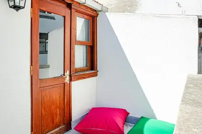 a red pillow sitting next to a door at The Wall Private Mansion Kumkapı in Istanbul