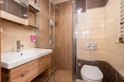 a bathroom with a sink and a toilet at Fulya Süit Hotel in Istanbul