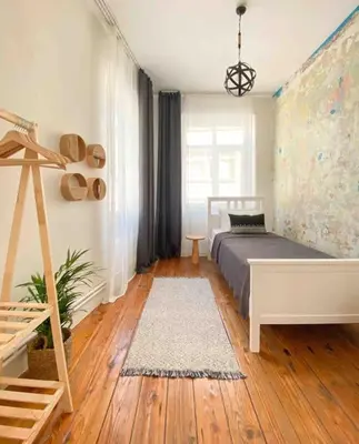 a bedroom with a bed and a wooden floor at Charming historical apartment in Galata in Istanbul