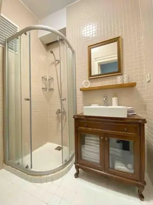 a bathroom with a shower and a sink at Charming historical apartment in Galata in Istanbul