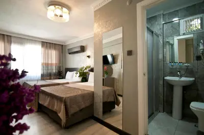 a hotel room with a bed and a bathroom at Gzh Park Bosphorus in Istanbul