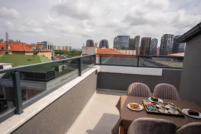 a balcony with a table with plates of food on it at Luxury Life Suites in Istanbul