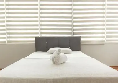 a white bed with a towel on top of it at Zeplin Otel in Istanbul