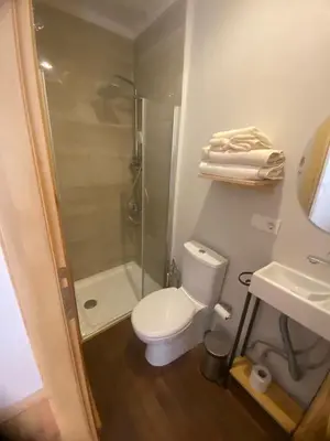 a bathroom with a toilet and a shower and a sink at Fatih Balatta Pink Home 3 in Istanbul