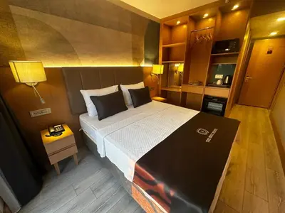 a bedroom with a large bed in a room at The Best Hotel İstanbul in Istanbul