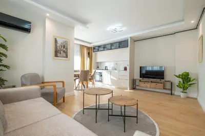 a living room with a couch and a table at Mayer Skycon Residence Besiktas in Istanbul