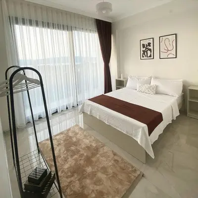 a bedroom with a bed and a large window at High Garden Villas in Sapanca