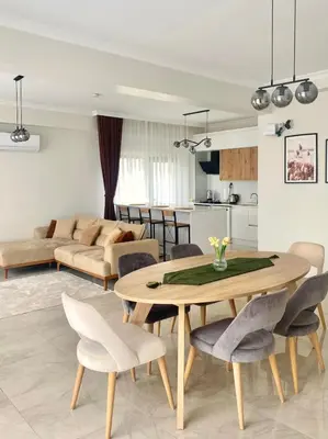 a kitchen and living room with a table and chairs at High Garden Villas in Sapanca