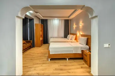 a hotel room with a bed and a chair at Pio Apart Hotel in Istanbul