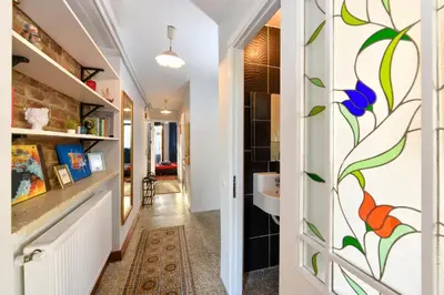 a hallway with a bathroom with a stained glass window at Taksim-Galata Tower Is Almost In Your Bedroom And In The Balconies Rooftop Terrace with Golden Horn View in Istanbul
