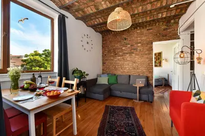 a living room with a brick wall at Taksim-Galata Tower Is Almost In Your Bedroom And In The Balconies Rooftop Terrace with Golden Horn View in Istanbul