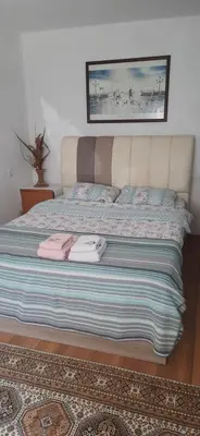 a bed with towels on it in a bedroom at Town center house in İznik