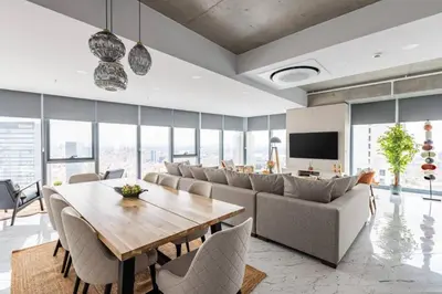 a living room with a table and a couch at Gorgeous 3BD2Bath Bright Airy Penthouse! #355 in Istanbul
