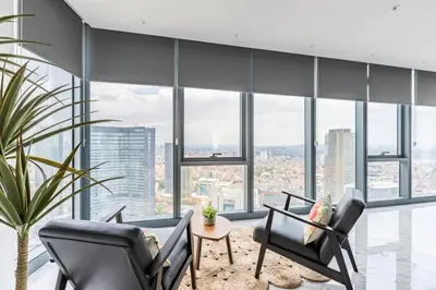 a living room with a lot of windows at Gorgeous 3BD2Bath Bright Airy Penthouse! #355 in Istanbul