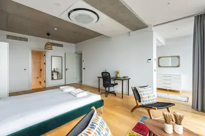 a bedroom with a large bed and a desk at Gorgeous 3BD2Bath Bright Airy Penthouse! #355 in Istanbul