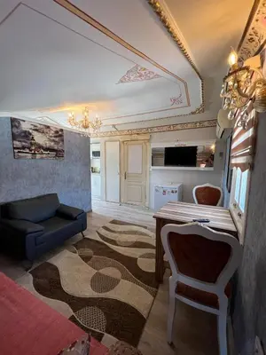 a living room with a couch and a table at Mihri Hatun Suite in Istanbul