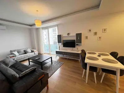 a living room with a couch and a table at Cozy Homes - 2 Rooms & 1 Living room Apartment in Esenyurt