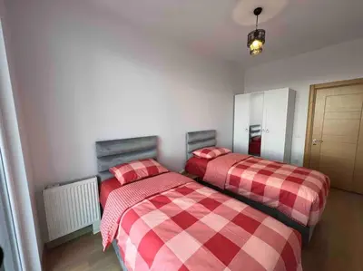 two beds sitting next to each other in a room at Cozy Homes - 2 Rooms & 1 Living room Apartment in Esenyurt