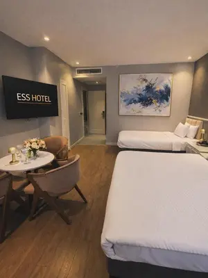a hotel room with two beds and a table at Ess Hotel in Istanbul