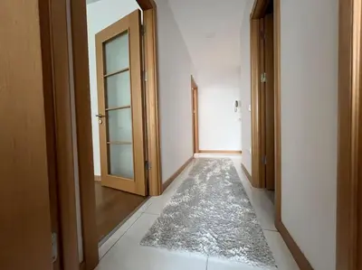 an empty hallway with a door and a rug at Cozy Homes 2 Room Apartment Well Designed in Esenyurt