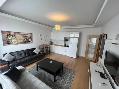 a living room with a couch and a table at Cozy Homes 2 Room Apartment Well Designed in Esenyurt