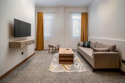 a living room with a couch and a coffee table at Urban Quarters - Boğazkesen in Istanbul
