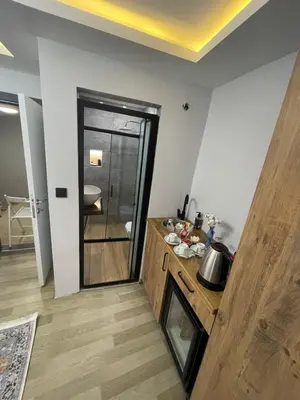 a room with a kitchen with a counter and a sink at Le Valeria Deluxe in Istanbul