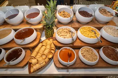 a buffet with bowls of different types of food at Rayelin Hotel Old Town in Istanbul