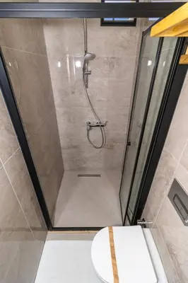 a bathroom with a shower with a toilet at Wond House in Istanbul