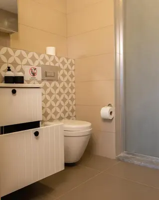 a bathroom with a white toilet in a room at Frezya Family Hotel in Istanbul
