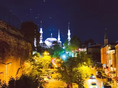 a view of a city at night with a mosque at Konak Grand Bella Sultanahmet in Istanbul