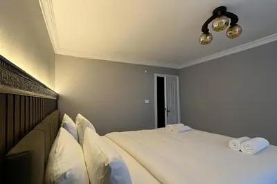a bedroom with two beds with white pillows at Ozer Hotel & Apartments in Istanbul