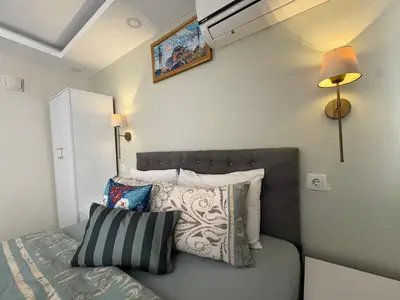 a bedroom with a bed with pillows on it at Ozer Hotel & Apartments in Istanbul