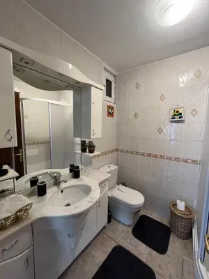 a bathroom with a sink and a toilet at Acıbadem Kadıköy Daire in Istanbul