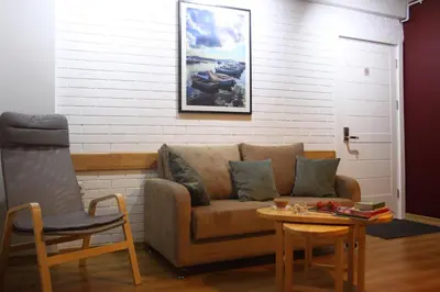 a living room with a couch and a table at TownHouse Istanbul in Istanbul