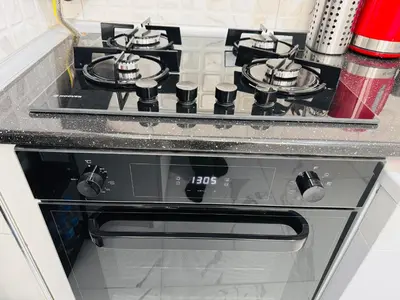 a black stove top oven in a kitchen at Jasmin in Istanbul