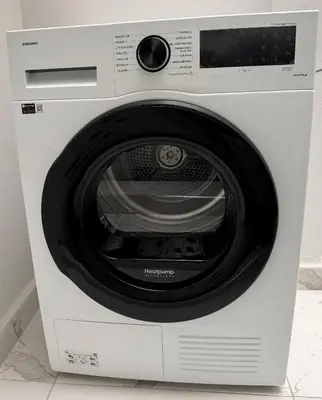 a white washing machine is sitting on a counter at Jasmin in Istanbul