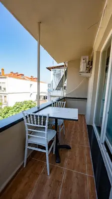 a balcony with a table and chairs on a building at Sea Sparkle in Istanbul