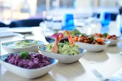 a table topped with bowls of different types of food at 10 Karakoy in Istanbul