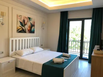 a bedroom with a bed and a large window at GateMaşukiye in Kartepe