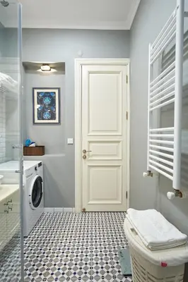 a bathroom with a white door and a washing machine at Nostalgic & Comfortable Historical Home! in Istanbul