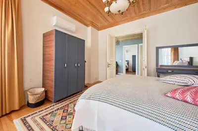 a bedroom with a large bed and a wooden ceiling at Nostalgic & Comfortable Historical Home! in Istanbul