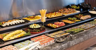a buffet line with many different types of food at Lilium Hotel & Suites in Bursa