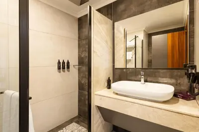 a bathroom with a sink and a mirror at Lilium Hotel & Suites in Bursa