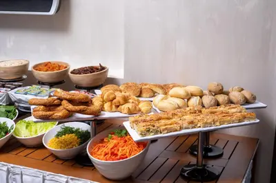 a buffet with many different types of food on display at Great Fortune Concept Hotel in Istanbul