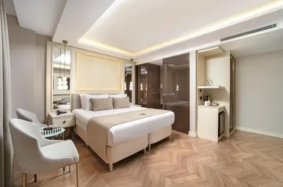 a bedroom with a large bed and a bathroom at Great Fortune Concept Hotel in Istanbul