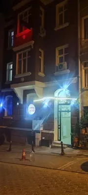 a building with a sign in front of it at night at Hotel Acar in Istanbul