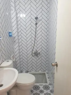 a bathroom with a white toilet and a sink at Hotel Acar in Istanbul