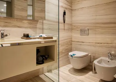 a bathroom with a toilet and a sink at Fer Hotel in Istanbul